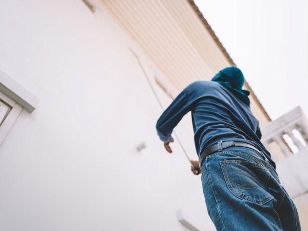 Man painting white wall house faded film look